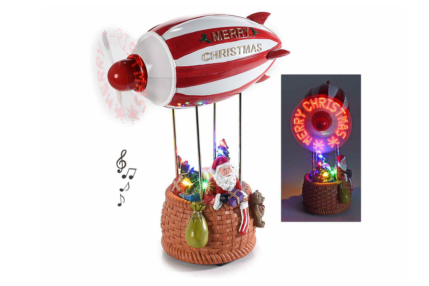 Carillon. Dirigibile Babbo Natale, eliche con scritte, musica e luci LED. Misure: cm 16,5 x 8,5 x 21. Funziona con 3 pile ministilo non incluse - Con eliche in movimento - Scatola: 20 x 13 x 26 H
