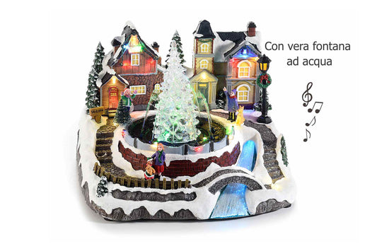 Carillon. Paesaggio  natalizio animato in resina con vera fontana ad acqua e fiume in fibra ottica, luci led e musica. Misure: cm 27 x 23,5 x 19,5 H
Funziona con 3 pile stilo non incluse.