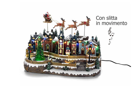 Carillon. Paesaggio natalizio con movimento, luci multicolore e musica. Misure: cm 38 x 21 x 25 H
Cavo: 180 cm - Con albero, renne e slitta in movimento.